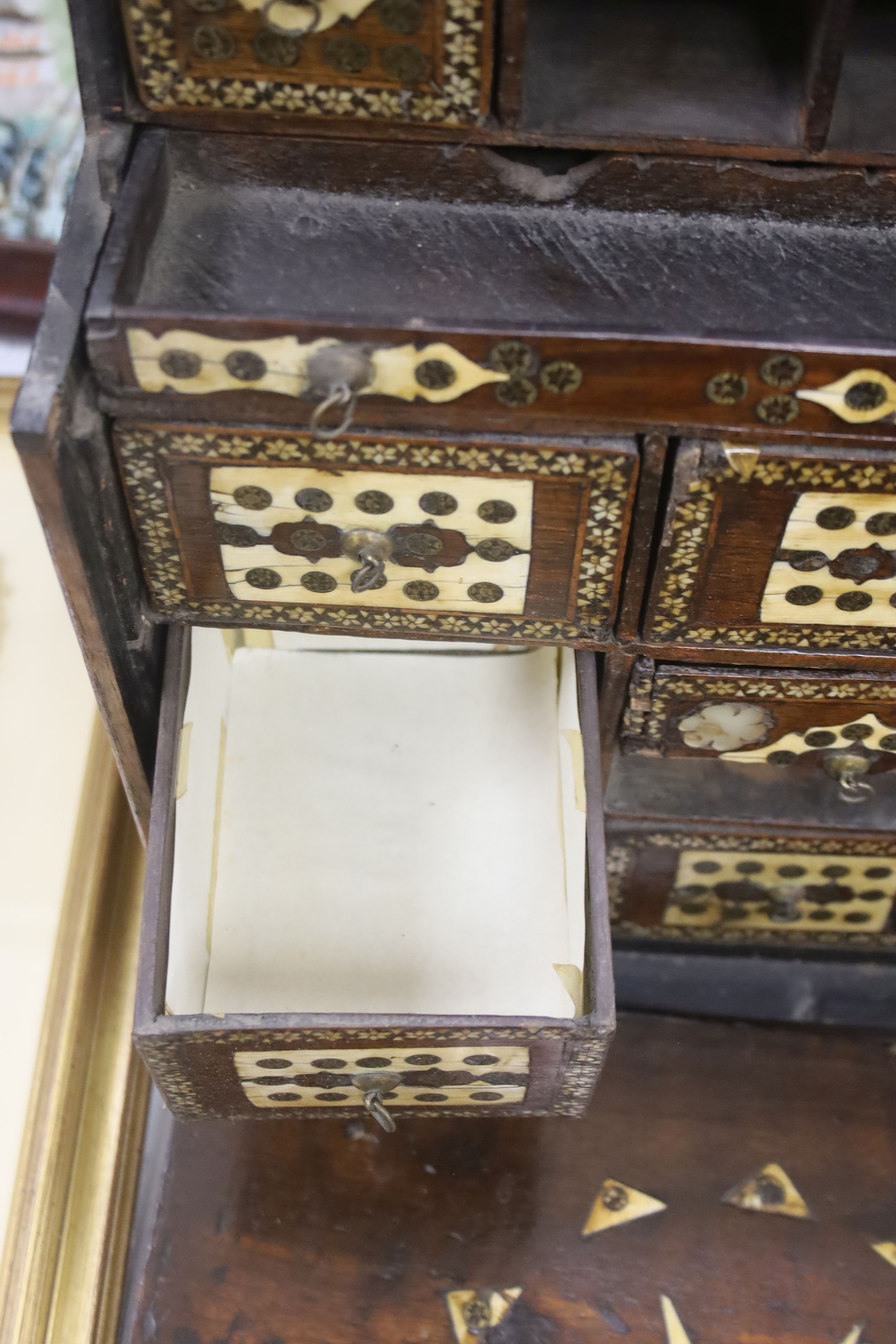 A 17th century Hispano Moresque bone inlaid walnut table cabinet 40cm